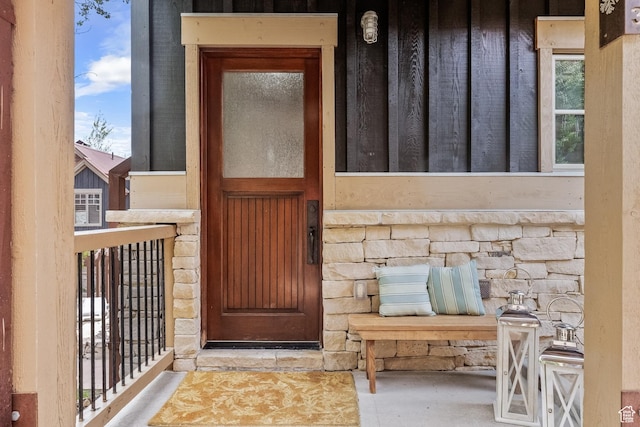 doorway to property with stone siding