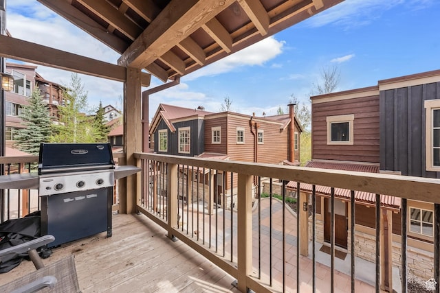 deck with a residential view and grilling area