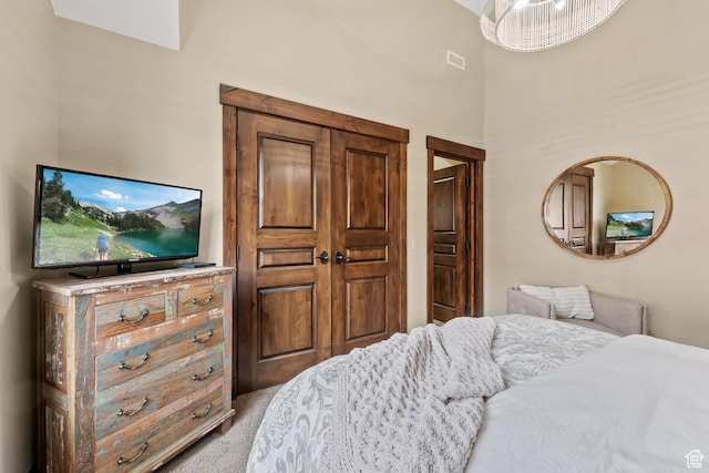 bedroom featuring light carpet