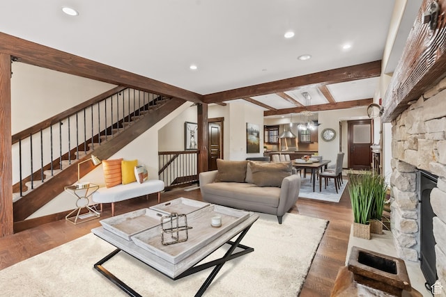 living room featuring recessed lighting, stairway, beamed ceiling, and wood finished floors