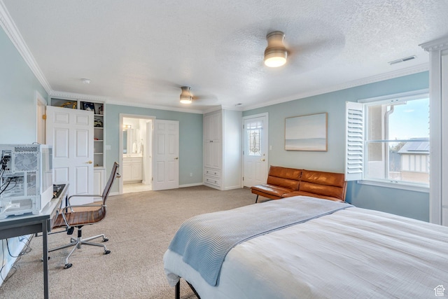 bedroom with baseboards, visible vents, a textured ceiling, crown molding, and light carpet