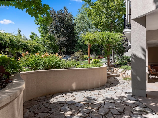 view of patio with a balcony