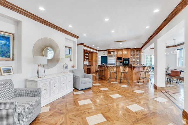 living area featuring recessed lighting, baseboards, and ornamental molding