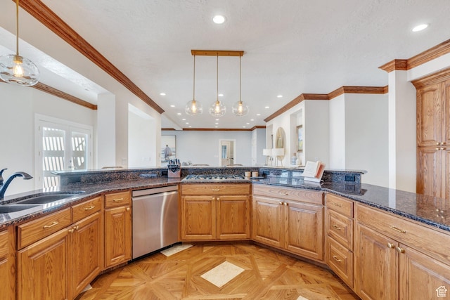 kitchen featuring dark stone countertops, recessed lighting, a sink, hanging light fixtures, and stainless steel appliances