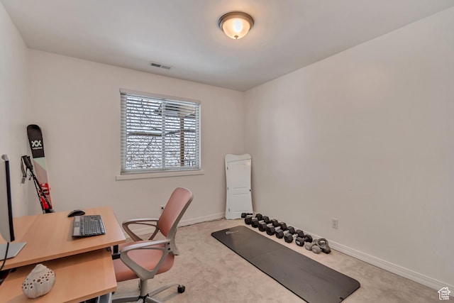 office area with carpet flooring, baseboards, and visible vents