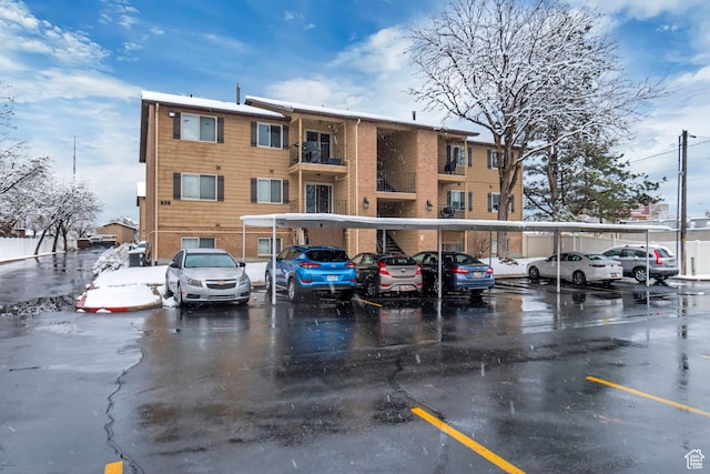 view of building exterior with covered parking