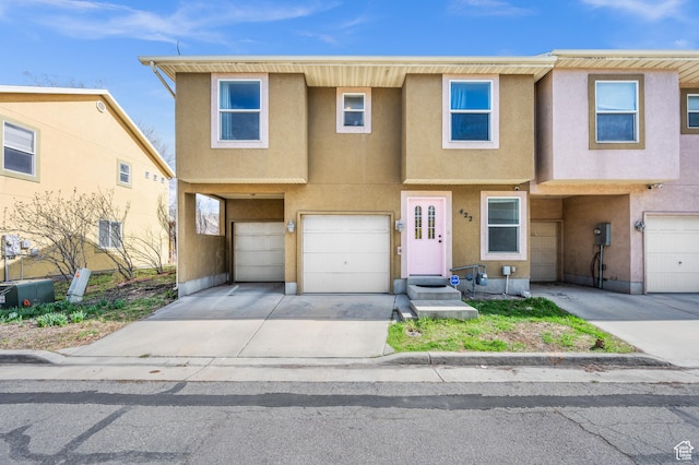 422 N Hodges Ln, Salt Lake City, UT 84116 - multi unit property featuring an attached garage, driveway, and stucco siding