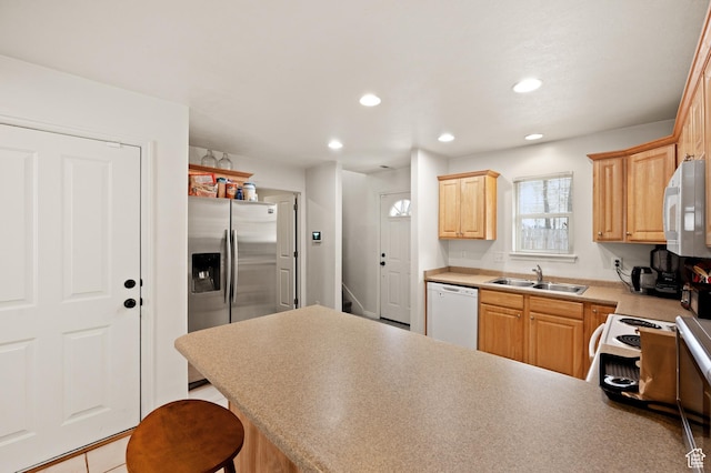 422 N Hodges Ln, Salt Lake City, UT 84116 - kitchen featuring a sink, white appliances, a peninsula, and recessed lighting