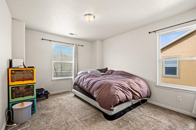 422 N Hodges Ln, Salt Lake City, UT 84116 - bedroom featuring carpet flooring, visible vents, and baseboards