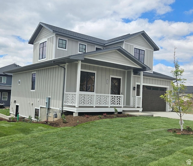 modern inspired farmhouse with a porch, board and batten siding, a front yard, and driveway