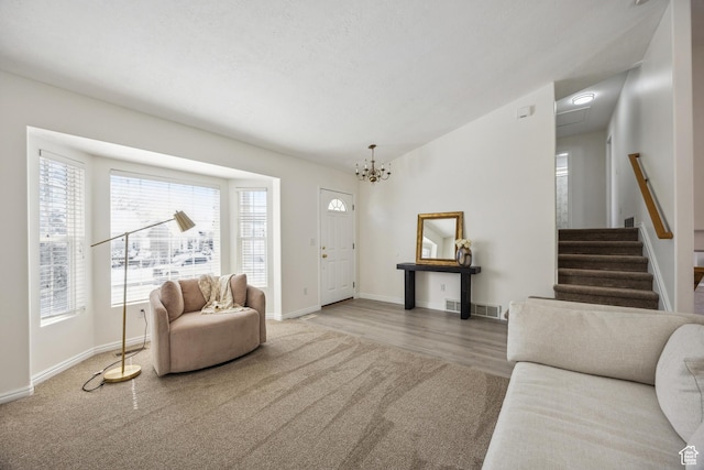 696 W 1275 N, Farmington, UT 84025 - carpeted living area with baseboards, a chandelier, stairs, and wood finished floors