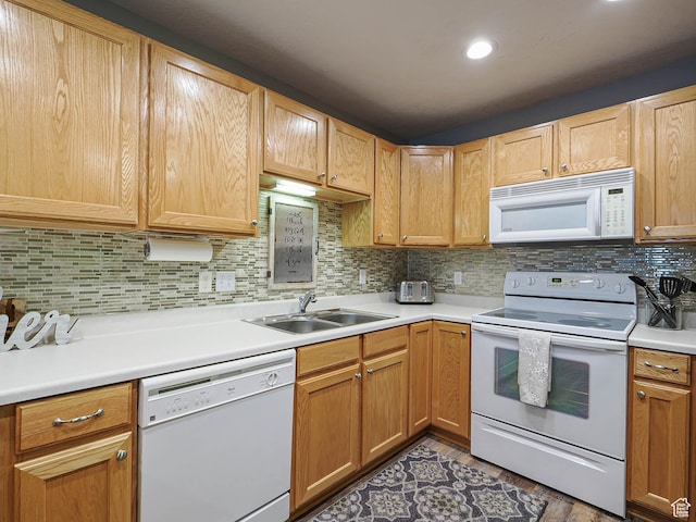 1230 E Privet Dr Unit 214, Salt Lake City, UT 84121 - kitchen featuring white appliances, a sink, light countertops, decorative backsplash, and wood finished floors
