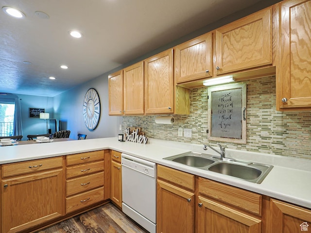 1230 E Privet Dr Unit 214, Salt Lake City, UT 84121 - kitchen featuring white dishwasher, a sink, a peninsula, dark wood finished floors, and light countertops
