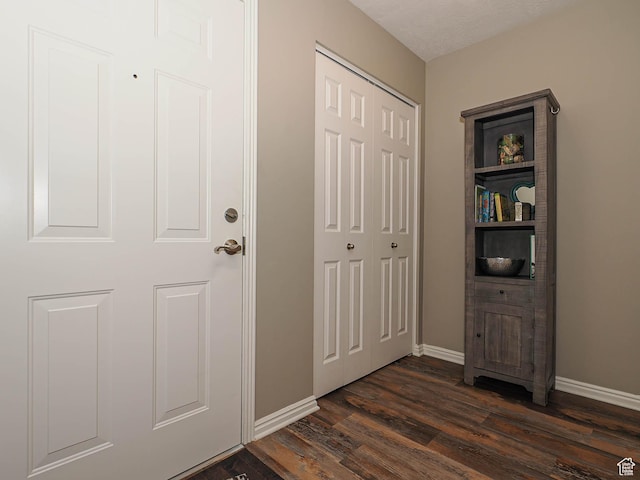 1230 E Privet Dr Unit 214, Salt Lake City, UT 84121 - foyer featuring dark wood finished floors and baseboards