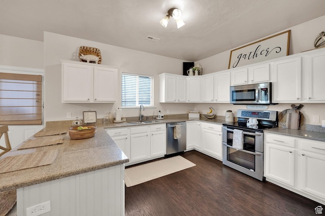 8813 S Bornite Rd, West Jordan, UT 84081 - kitchen featuring stainless steel appliances, a sink, dark wood finished floors, visible vents, and white cabinetry
