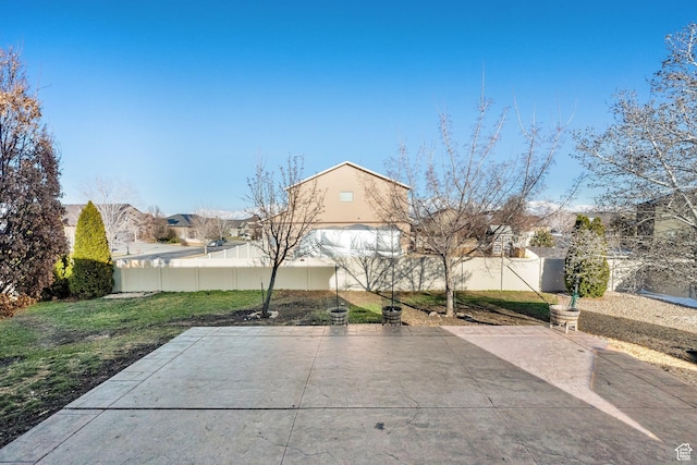 8813 S Bornite Rd, West Jordan, UT 84081 - exterior space featuring a fenced backyard, a residential view, and a patio