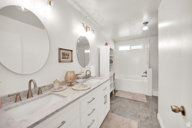 8813 S Bornite Rd, West Jordan, UT 84081 - full bathroom with a washtub, baseboards, a sink, and double vanity