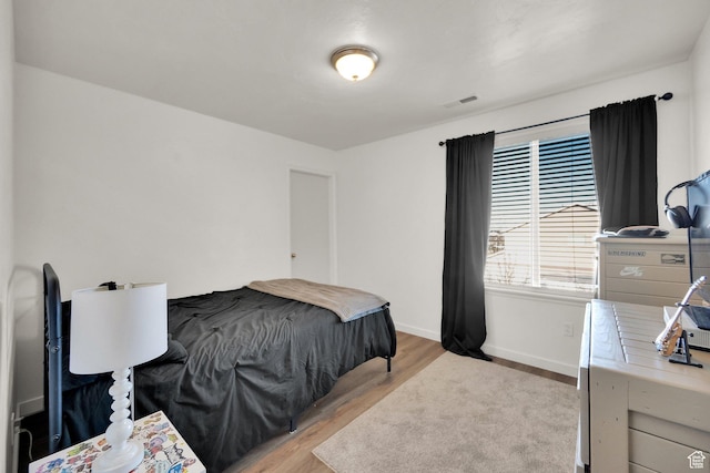 8813 S Bornite Rd, West Jordan, UT 84081 - bedroom featuring baseboards, light wood-style floors, and visible vents