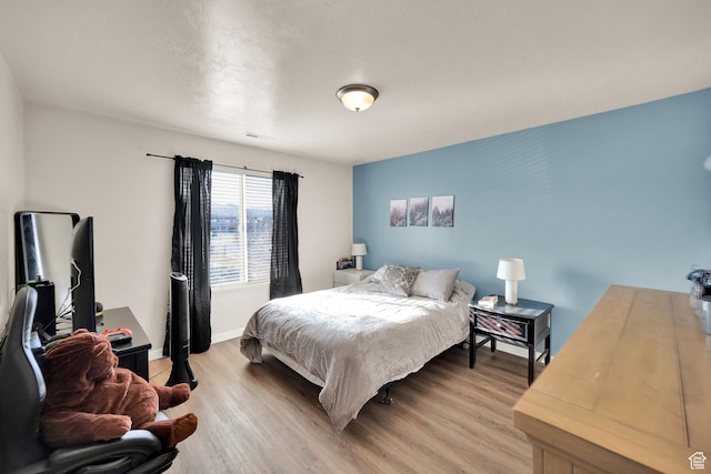 8813 S Bornite Rd, West Jordan, UT 84081 - bedroom with light wood-type flooring, baseboards, and visible vents