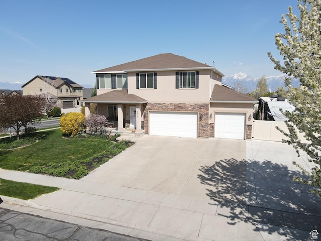 8813 S Bornite Rd, West Jordan, UT 84081 - traditional home featuring fence, concrete driveway, stucco siding, stone siding, and a front yard