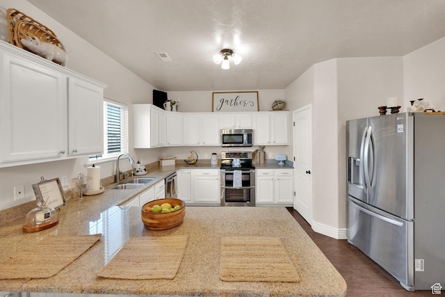 8813 S Bornite Rd, West Jordan, UT 84081 - kitchen with white cabinets, appliances with stainless steel finishes, a sink, and light countertops