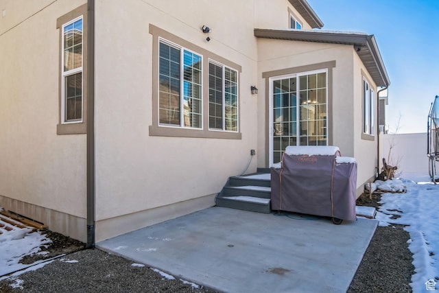 5731 W Osprey Dr, Stansbury Park, UT 84074 - snow covered patio featuring a patio and grilling area