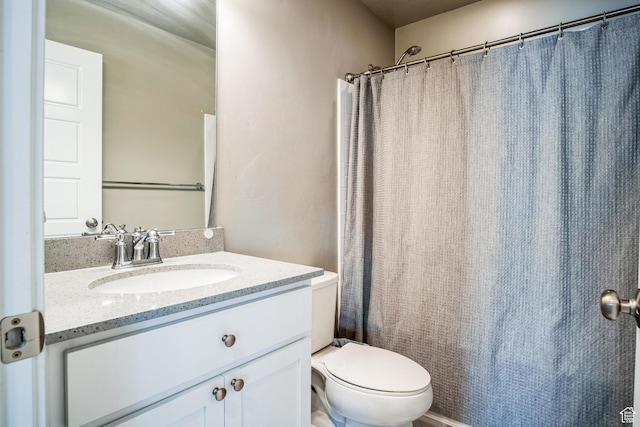 5731 W Osprey Dr, Stansbury Park, UT 84074 - full bath featuring vanity, toilet, and a shower with shower curtain