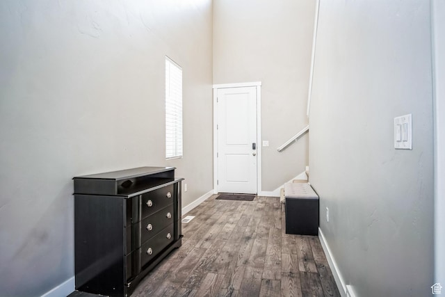 5731 W Osprey Dr, Stansbury Park, UT 84074 - hallway with wood finished floors and baseboards