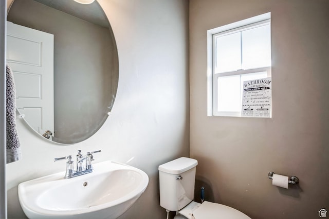 5731 W Osprey Dr, Stansbury Park, UT 84074 - half bathroom with a sink and toilet