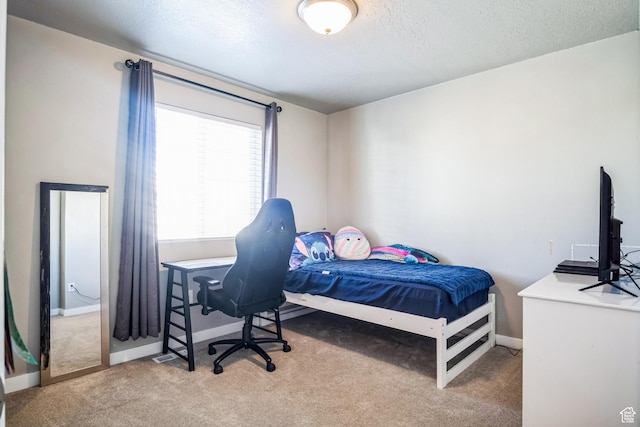 5731 W Osprey Dr, Stansbury Park, UT 84074 - bedroom featuring carpet flooring, baseboards, and a textured ceiling