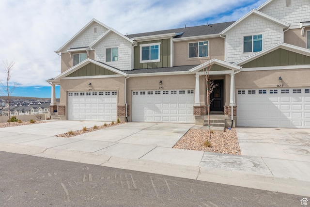 973 N Ledger Dr, Saratoga Springs, UT 84045 - craftsman-style house featuring concrete driveway, an attached garage, board and batten siding, and stucco siding