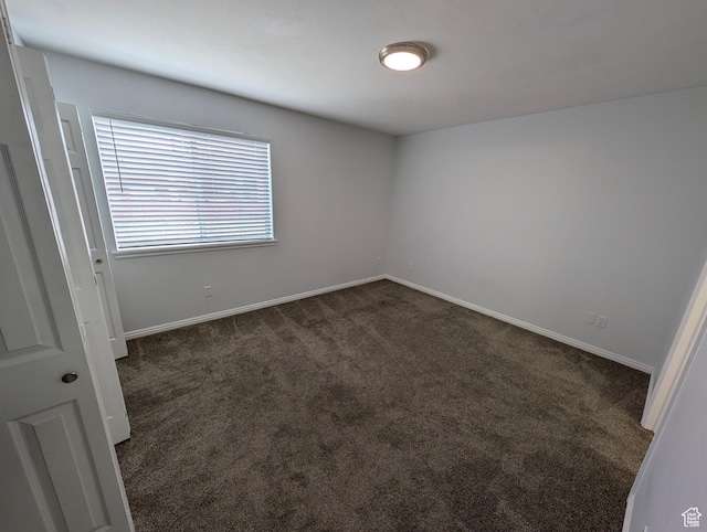 577 N 100 W Unit 102, Provo, UT 84601 - empty room with baseboards and dark colored carpet