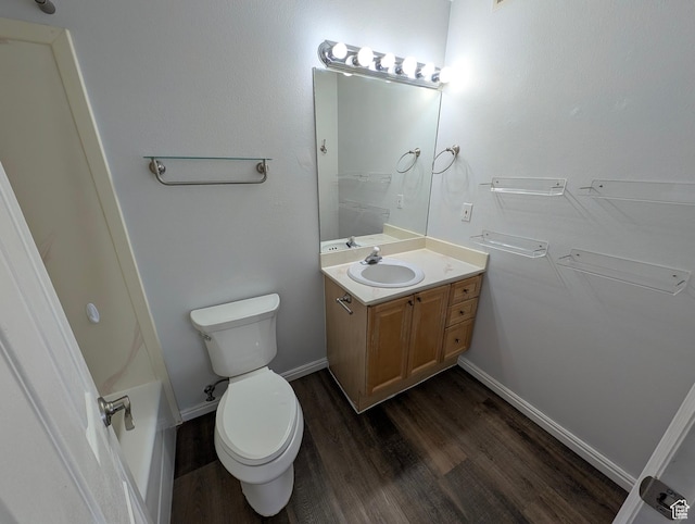 577 N 100 W Unit 102, Provo, UT 84601 - bathroom featuring baseboards, wood finished floors, toilet, and vanity