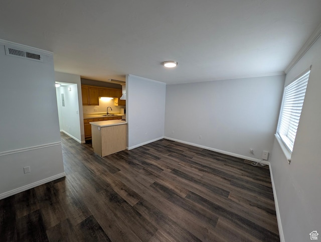 577 N 100 W Unit 102, Provo, UT 84601 - unfurnished living room featuring dark wood-style floors, visible vents, and baseboards