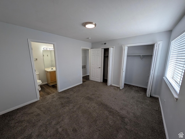 577 N 100 W Unit 102, Provo, UT 84601 - unfurnished bedroom with baseboards, two closets, carpet floors, and a sink