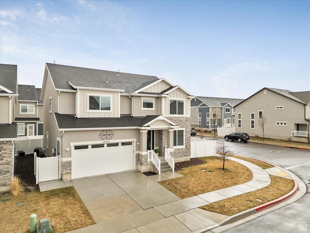 4089 W 1700 N Unit 618, Lehi, UT 84043 - view of property featuring an attached garage, fence, board and batten siding, and stone siding