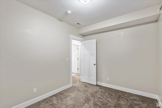 4089 W 1700 N Unit 618, Lehi, UT 84043 - spare room featuring visible vents, carpet flooring, a textured ceiling, and baseboards