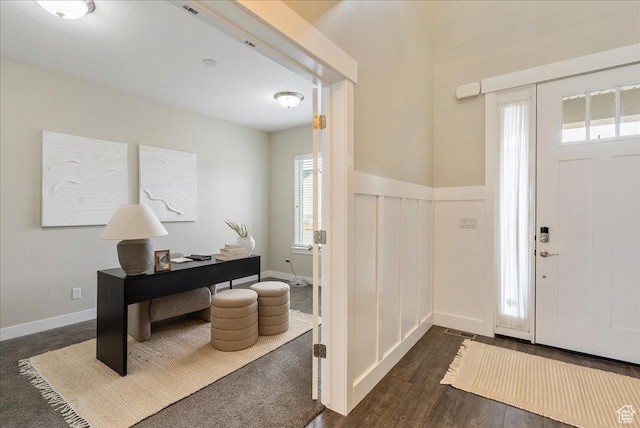4089 W 1700 N Unit 618, Lehi, UT 84043 - foyer entrance with dark wood finished floors, baseboards, visible vents, and wainscoting