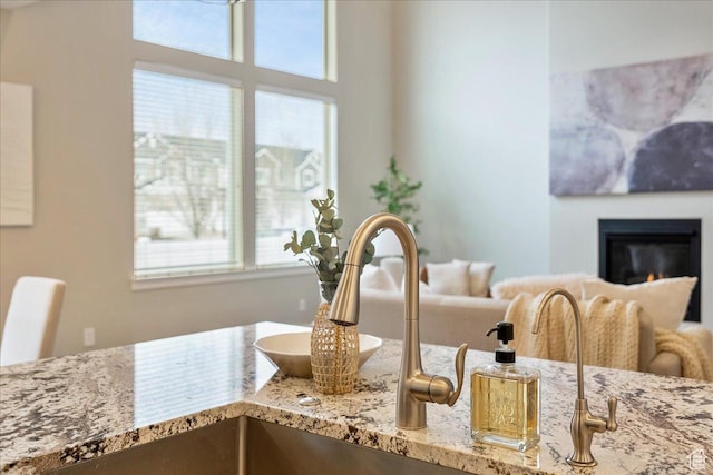 4089 W 1700 N Unit 618, Lehi, UT 84043 - interior space featuring a wealth of natural light and a glass covered fireplace