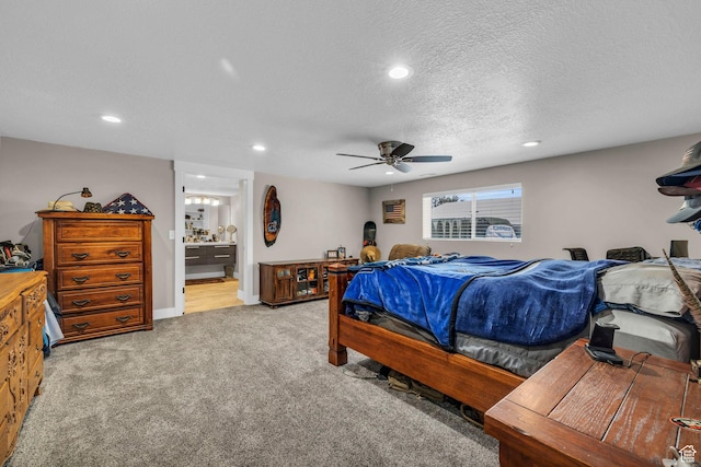 1411 E Elm Leaf Cv, Salt Lake City, UT 84117 - carpeted bedroom with a textured ceiling, recessed lighting, connected bathroom, baseboards, and ceiling fan