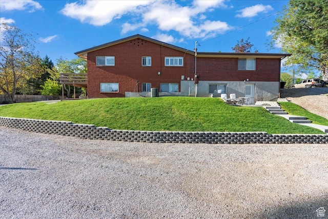 1411 E Elm Leaf Cv, Salt Lake City, UT 84117 - view of home's exterior with brick siding and a lawn