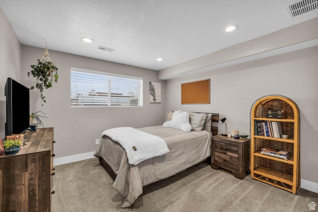 1411 E Elm Leaf Cv, Salt Lake City, UT 84117 - bedroom featuring light carpet, visible vents, a textured ceiling, and baseboards
