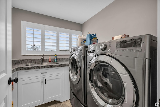 1411 E Elm Leaf Cv, Salt Lake City, UT 84117 - washroom with a sink, cabinet space, and washing machine and clothes dryer