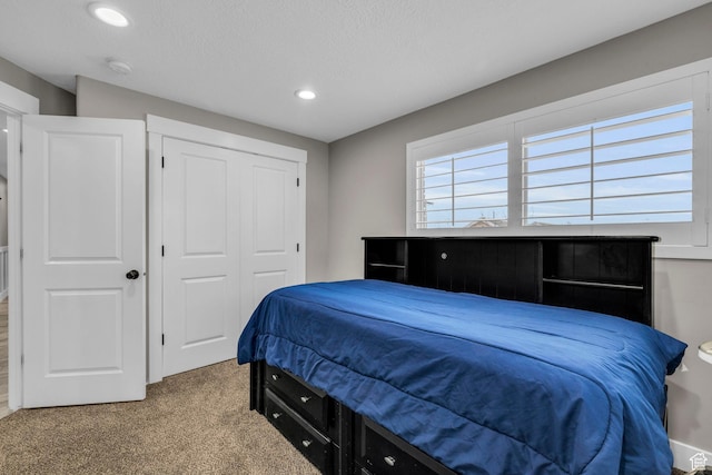 1411 E Elm Leaf Cv, Salt Lake City, UT 84117 - bedroom with a closet, carpet flooring, and recessed lighting
