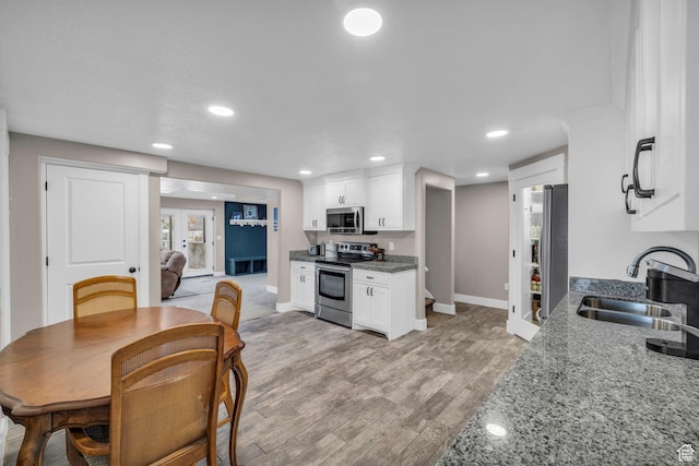 1411 E Elm Leaf Cv, Salt Lake City, UT 84117 - dining room featuring recessed lighting, light wood-type flooring, and baseboards