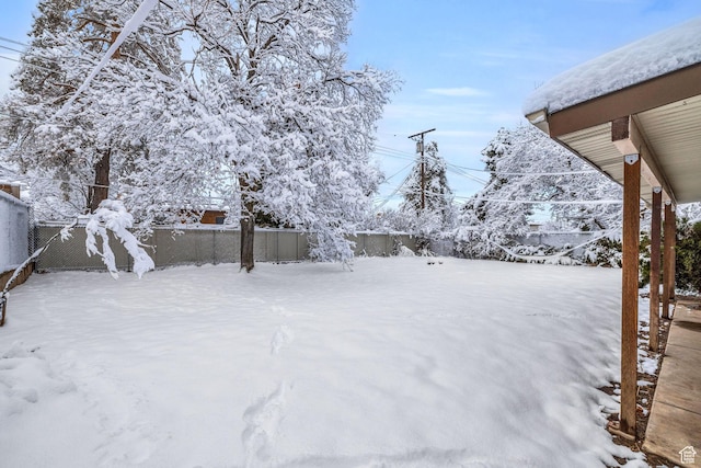 snowy yard with fence private yard