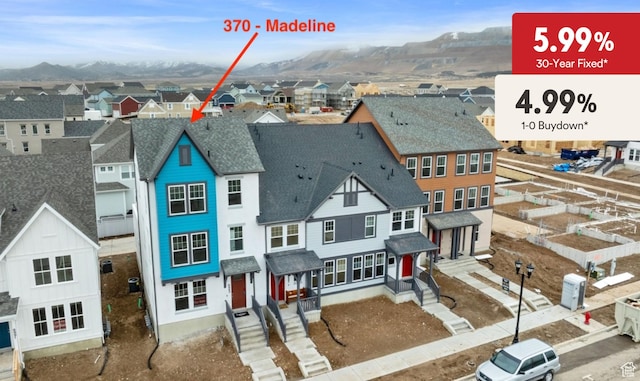 aerial view of residential area featuring a mountain backdrop