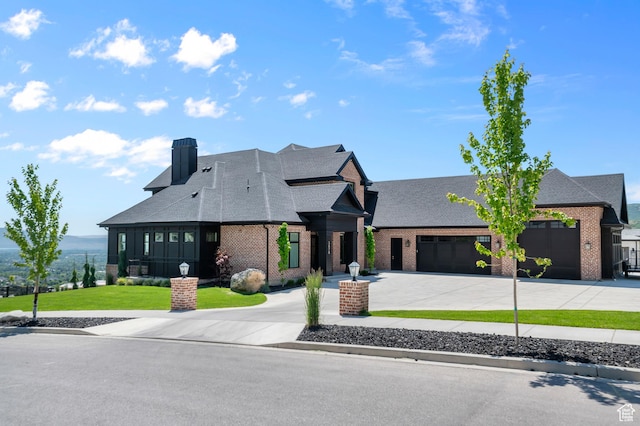3878 W Oak Hill Dr, Alpine, UT 84004 - view of front of home with curved driveway, brick siding, and a shingled roof