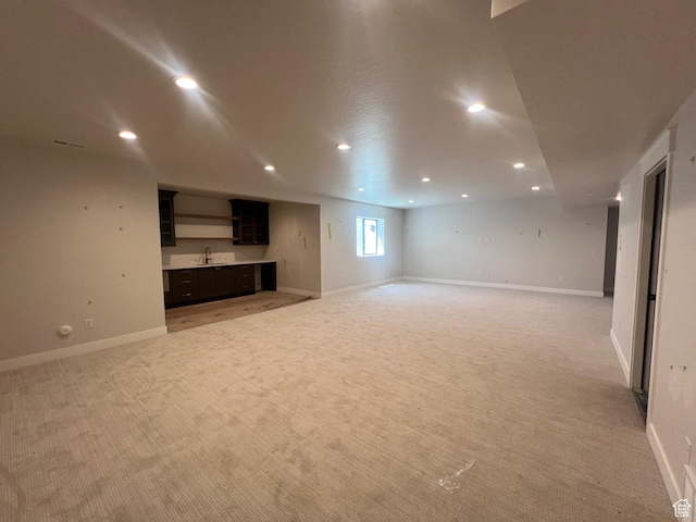 1185 N 2650 W, Lehi, UT 84043 - unfurnished living room with light carpet, recessed lighting, and bar with sink