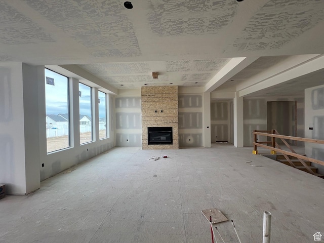 unfurnished living room featuring a fireplace